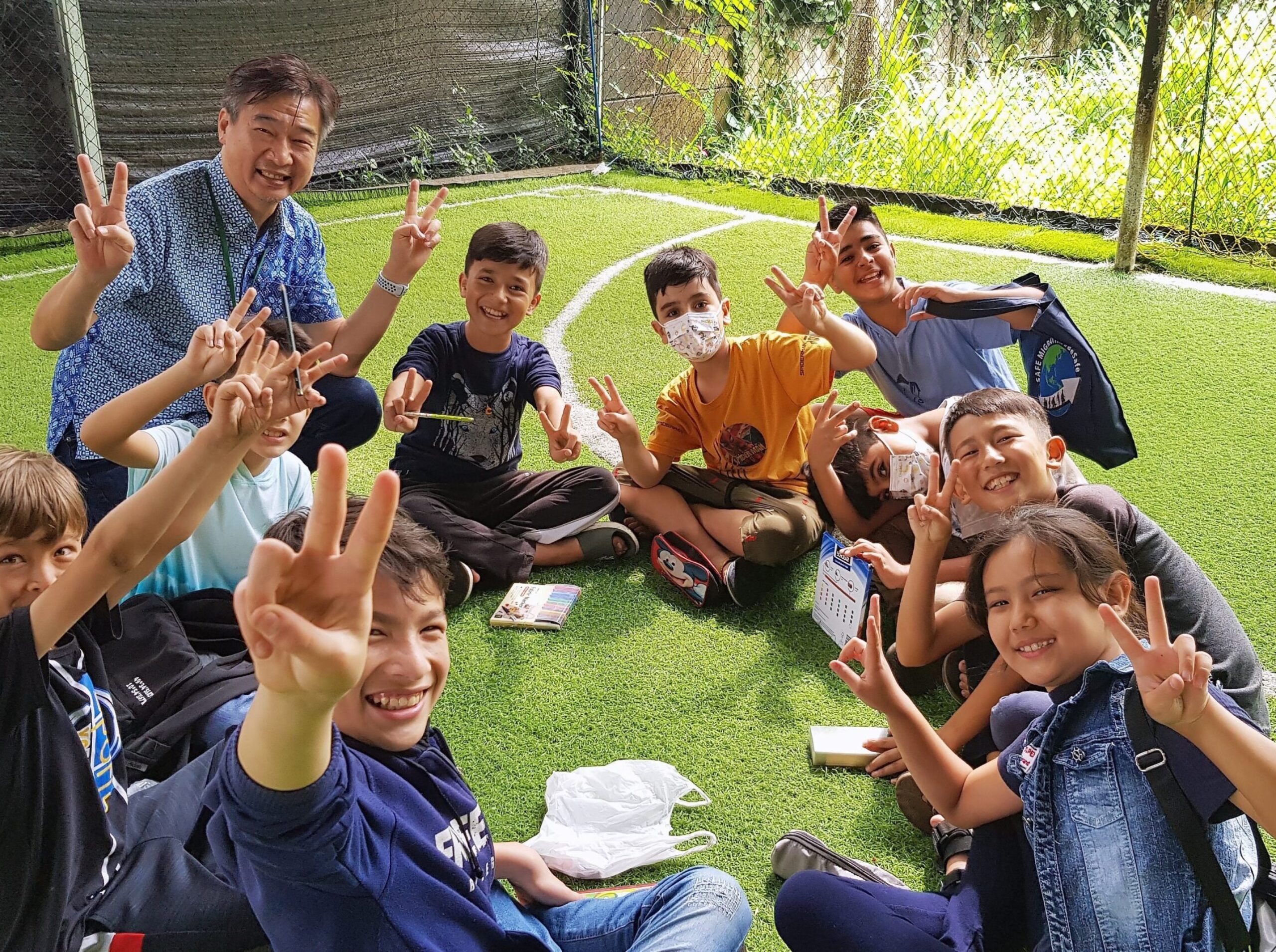 Foeng having fun  with the children at Refugee Learning Nest.